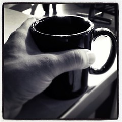 Coffee cup and hand