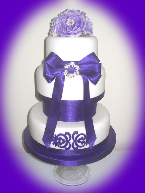 Cadbury Puple Wedding Cake 3 tier cake with deep purple satin ribbon and 