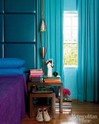 Jewel tones in the bedroom: Turquoise headboard & drapes + purple linens, from Metropolitan Home