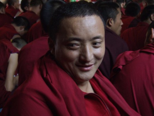 Quiet happiness, smiling monks face, red robes, Tharlam Monastery of Tibetan Buddhism, Bodha, Kathmandu, Nepal photo by Steve D. by Wonderlane