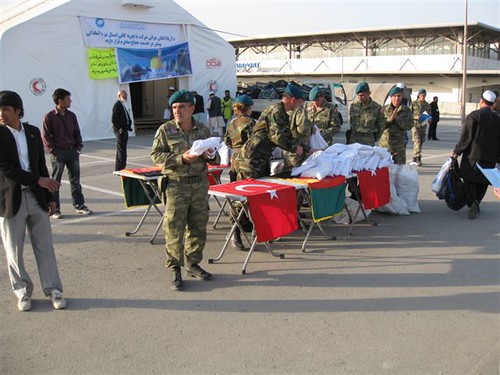 ISAF soldiers provide aid at Kabul airport. 