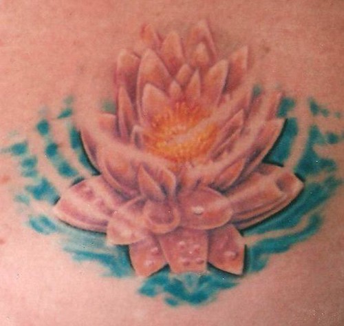 Lotus flower tattoo by thomas jacobson of baddog production's