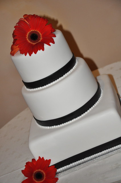 White Wedding Cake w Red Gerber Daisies