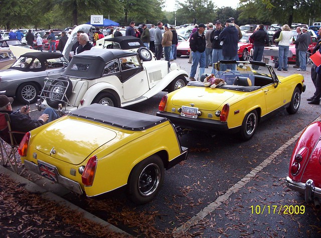 A yellow MG Midget and its matching trailer