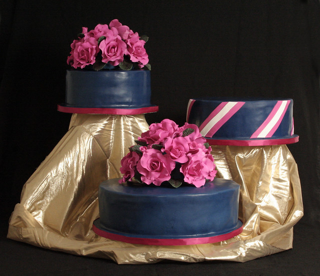The design is the bride's as her colors are navy blue and hot pink