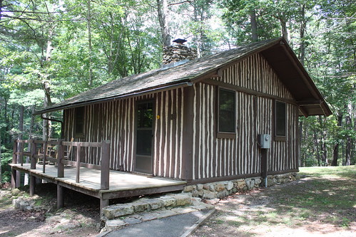 Cabin 9 is a one bedroom cabin with vertical logs.