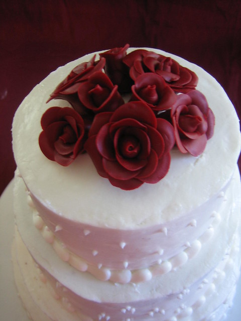 White Buttercream Wedding Cake with quilted bottom scroll work 