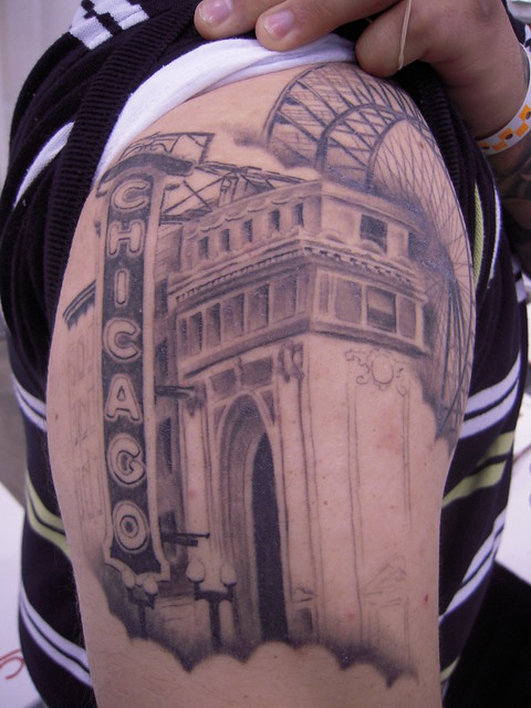 Michael Daddio shows part of his tattoo sleeve which includes the Chicago 