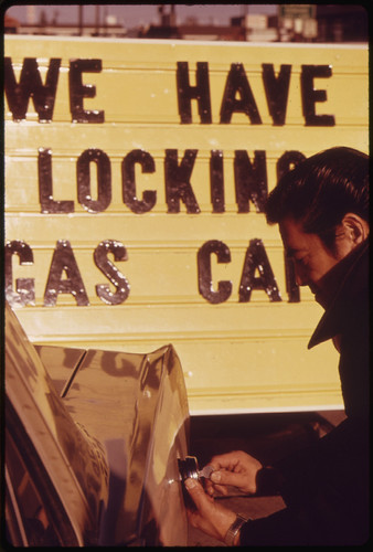 Sales of Gasoline Tank Locks Increased Dramatically During the Fuel Crisis in the Pacific Northwest, and Their Prices Doubled. A Gas Station Attendant Is Shown Unlocking a Customer's Tank 01/1974