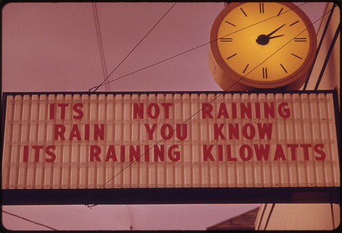 Lack of Rain Turned Into a Message on an Outdoor Advertising Sign, Asking People to Conserve Their Energy Output During the Fuel Crisis in Late 1973 in the Pacific Northwest 12/1973