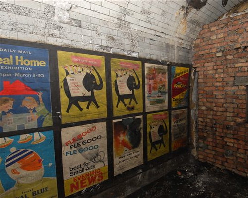Vintage 1950s advertising posters in disused passageways at Notting Hill Gate tube station, London - photographed in 2010