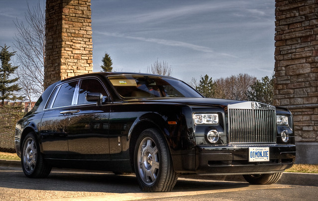 A Rolls Royce Phantom parked with it's Spirit of exstasy ornament retracted. The iron-man of world-class luxury cars.