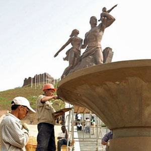Workers from the People's Democratic Republic of Korea (DPRK) finishing the African Renaissance Monument in Senegal. It is a representation of the historical struggle and contributions of the African peoples. by Pan-African News Wire File Photos