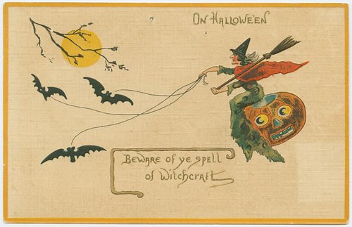 vintage illustration of witch riding a pumpking drawn by bats