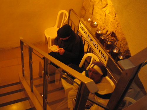 Women praying below stairs