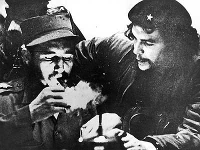 Leaders of the Cuban Revolution Fidel Castro and Che Guevara light a smoke during the early days of the transformation of the Caribbean nation into a socialist state. by Pan-African News Wire File Photos