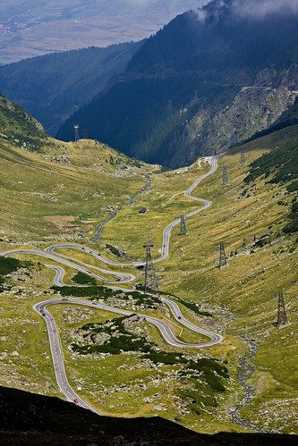 Road with hairpin turns through mountain valley