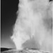 Taken at dusk or dawn from various angles during eruption. "Old Faithful Geyser, Yellowstone National Park," Wyoming. (vertical orientation)