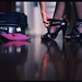 Suitcase, pink slippers, black shoes  - copyright Edward Olive photographer fotografo - photo available to license in Getty Image Collection