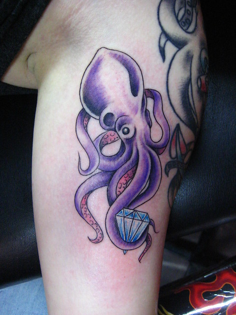 In addition to Cas' old school octopus tattoo a baby purple octopus with a
