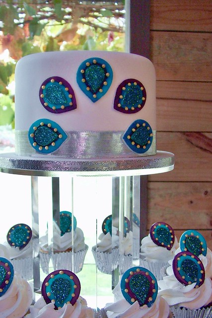 Wedding Cake Peacockthemed cupcakes and coordinating cutting cake for 