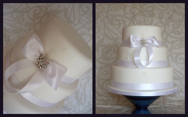white bow wedding cake simple and white
