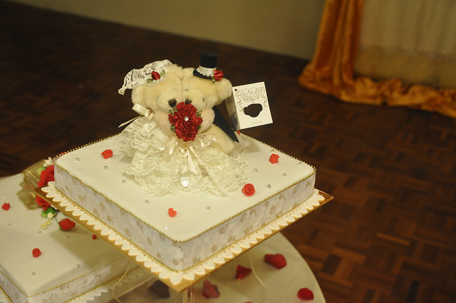 Gold White Wedding Cake Top tier is Fruit cake