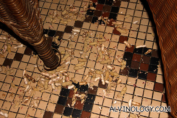 Guests are suppose to throw the peanut shells on the floor, following tradition in the bar