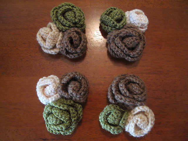 Crocheted rose wrist corsage in green, brown, cream, and sand colors