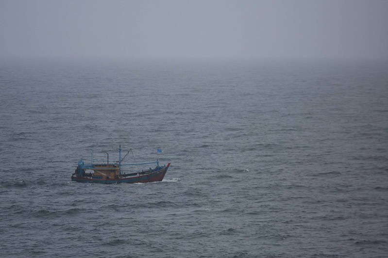 Fishing boat just before rain sweeps over it
