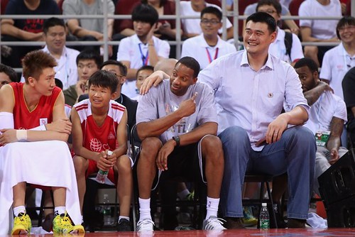 July 1st, 2013 - Yao Ming and Tracy McGrady watch the action as coaches in the Yao Foundation charity game in Beijing