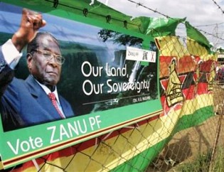 A Zimbabwe African National Union-Patriotic Front billboard calling for land and sovereignty. Mugabe won re-election on July 31, 2013. by Pan-African News Wire File Photos