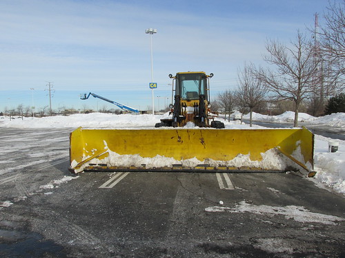 An extra wide snowplow attatchment. That much needed weapon in the seasonal war on parking lot snow removal.  Schaumburg Illinois.  Wednsday, January 8th, 2014. by Eddie from Chicago