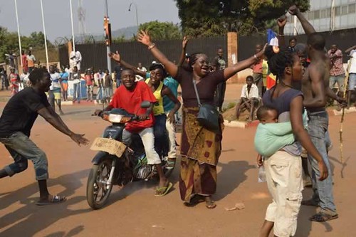 Central African Republic residents celebrating on January 10, 2014 after the forced resignation of Michel Djotodia. France is attempting to control its former colony. by Pan-African News Wire File Photos
