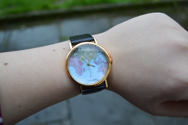 a picture of a map dial watch