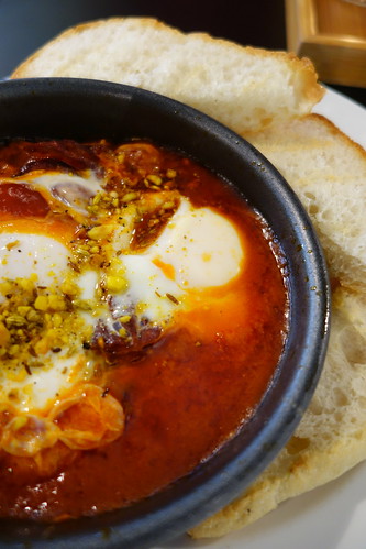 Strangers' Reunion's Baked Eggs in Shakshuka with Homemade Goat's Cheese, Dukkah & Toast. I added Salami to this.