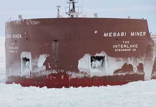 The motor vessel Mesabi Miner, a 990-foot laker, suffered a puncture in its bow about 4 feet above the waterline during a collision with the Coast Guard Cutter Hollyhock, a 225-foot sea-going buoy tender homeported in Port Huron, Mich., in northern Lake Michigan, Jan. 5, 2014. Both the Hollyhock and the Mesabi Miner were damaged in the collision but were able to continue underway. U.S. Coast Guard photo