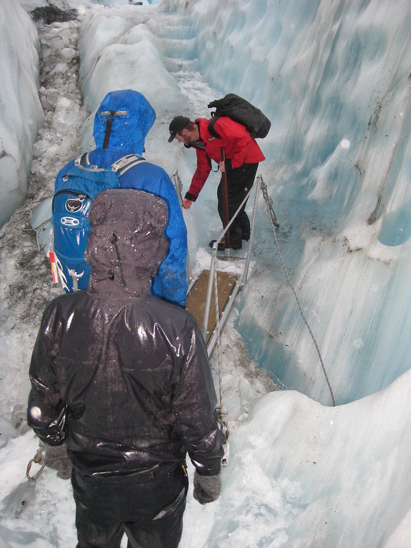 Crossing an ice chasm on Franz Josef Glacier - New Zealand