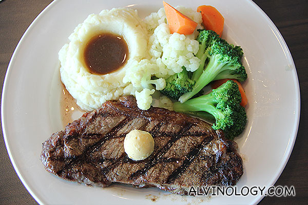 NEW YORK STRIP STEAK -  A (USDA) choice 21 day aged center-cut, 12 oz. New York strip steak grilled to your liking and topped with Merlot-garlic butter. Served with smashed potatoes, gravy and fresh vegetables.