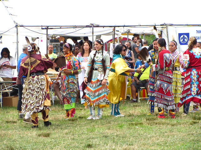 jingle dress dancers greet one another