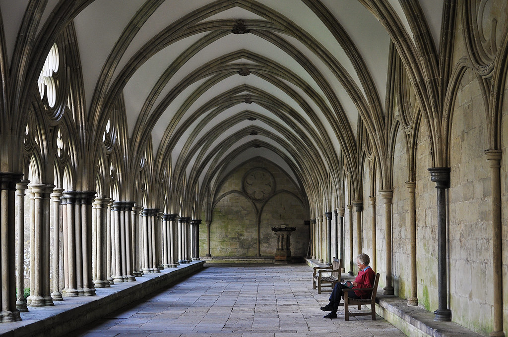 Woman reading in Salisbury Cathedral cloisters