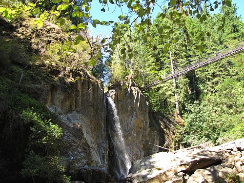 waterfall and suspension bridge from below