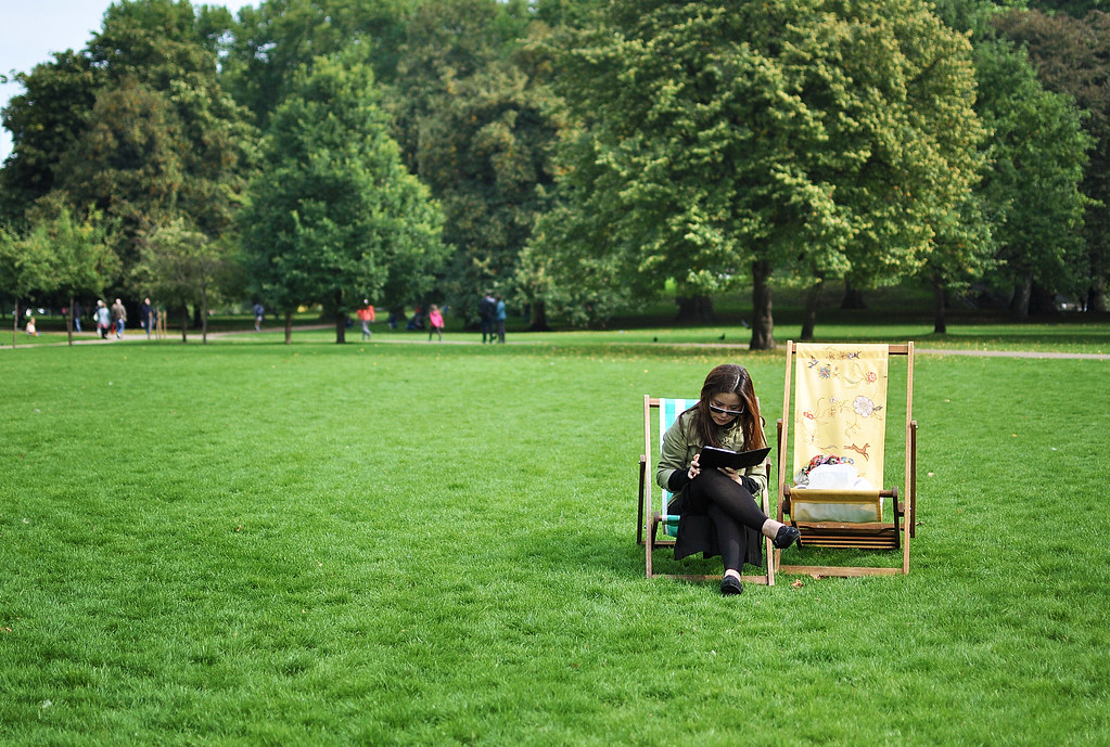 Reading on a lawn chair, London