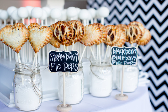 Lots of delicious pie pops displayed in mason jars with sugar