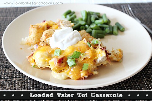 Loaded Tater Tot Casserole on plate with green beans and fork.