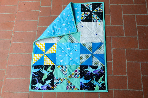 Baby quilt with pinwheels and dragons