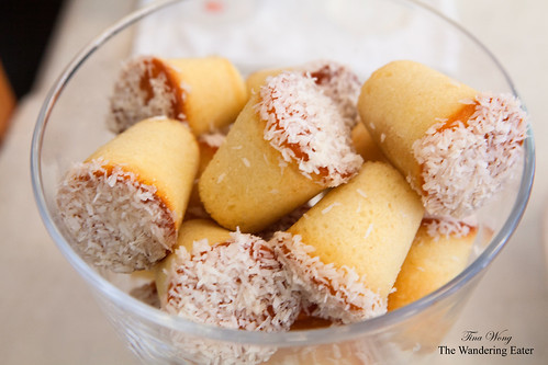 Bowl full of honey cakes topped with coconut