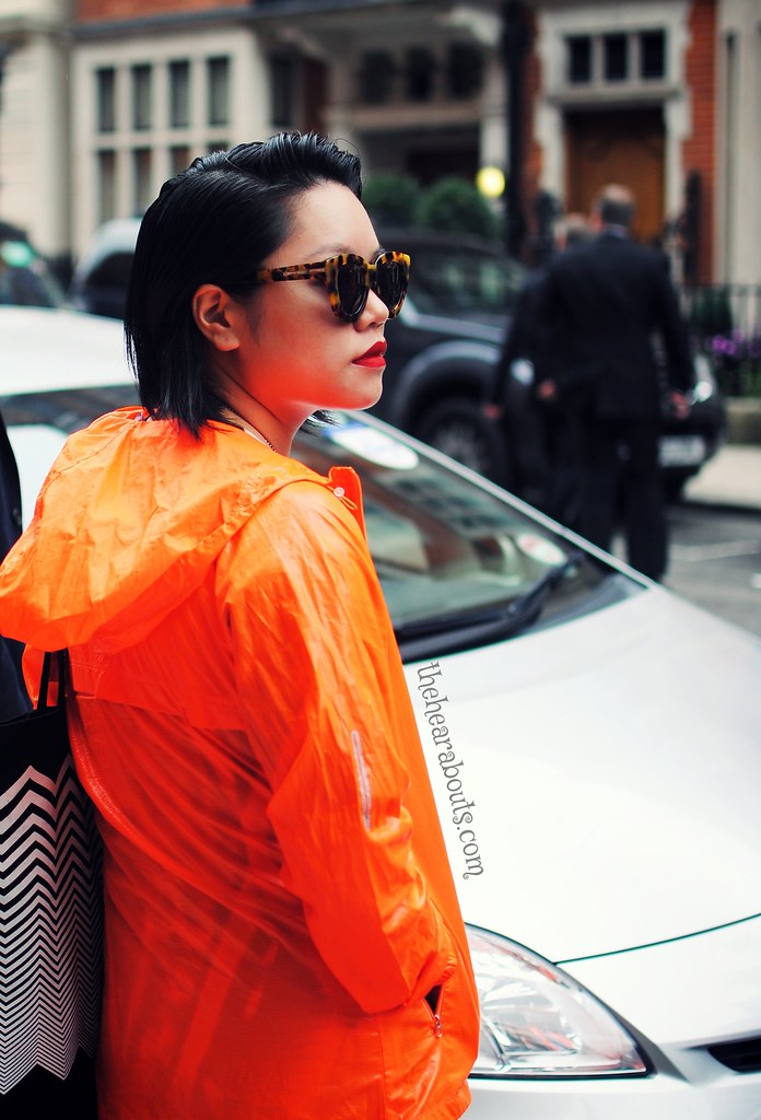 Orange raincoat streetstyle lfw