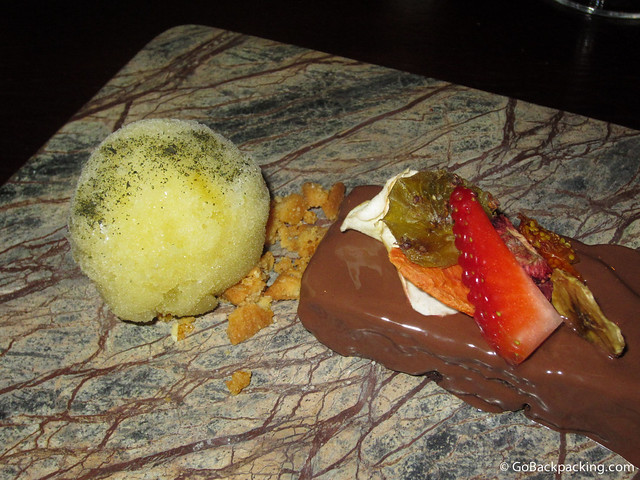 Lulo and tequila sorbet accompanies a chocolate cake garnished with dried fruits