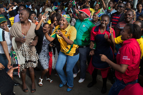 Crowds of South African celebrating the life of Nelson Mandela (1918-2013). Millions are mourning his loss. by Pan-African News Wire File Photos